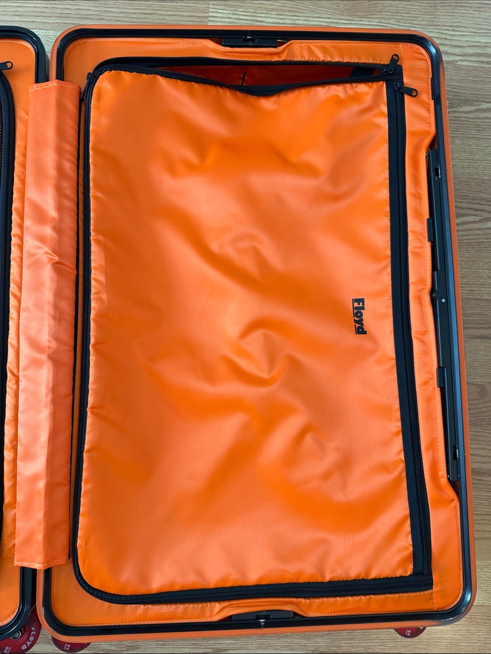 Floyd Brown Hardshell Suitcase with Bright Orange Interior and Red Wheels - Picture 14 of 17